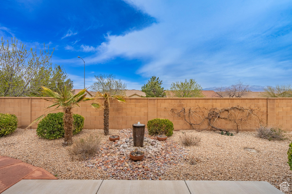 View of yard with a fenced backyard