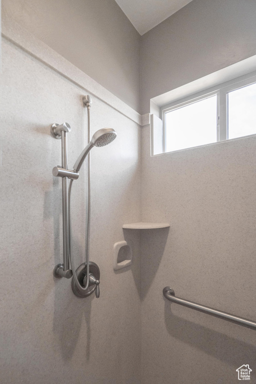 Room details featuring walk in shower