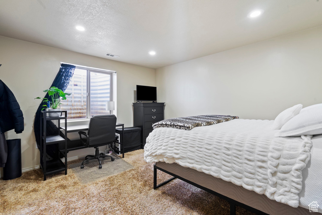 Bedroom featuring recessed lighting, visible vents, light colored carpet, and baseboards