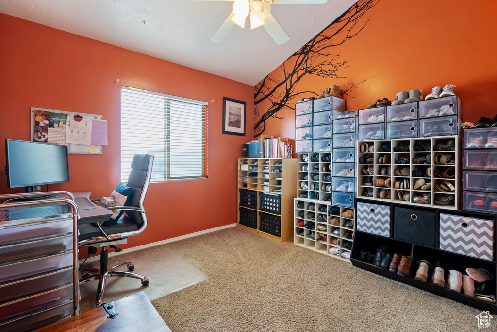 Office space with baseboards, carpet, a ceiling fan, and vaulted ceiling