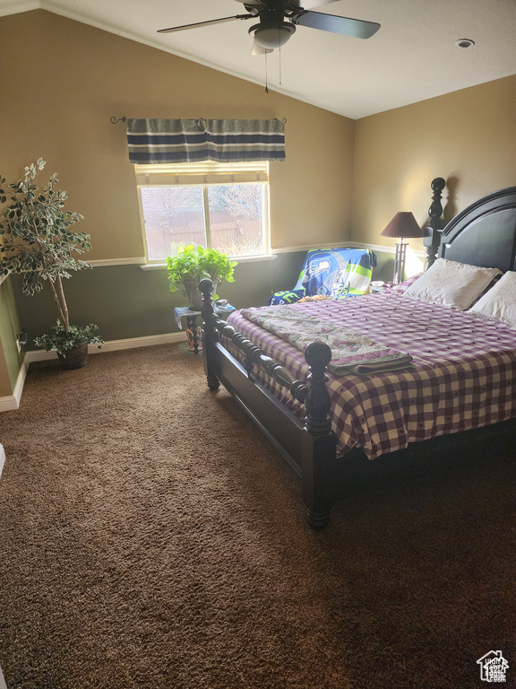 Bedroom with carpet floors, ceiling fan, baseboards, and vaulted ceiling
