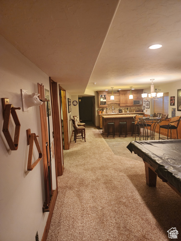 Game room with recessed lighting, a chandelier, and light carpet