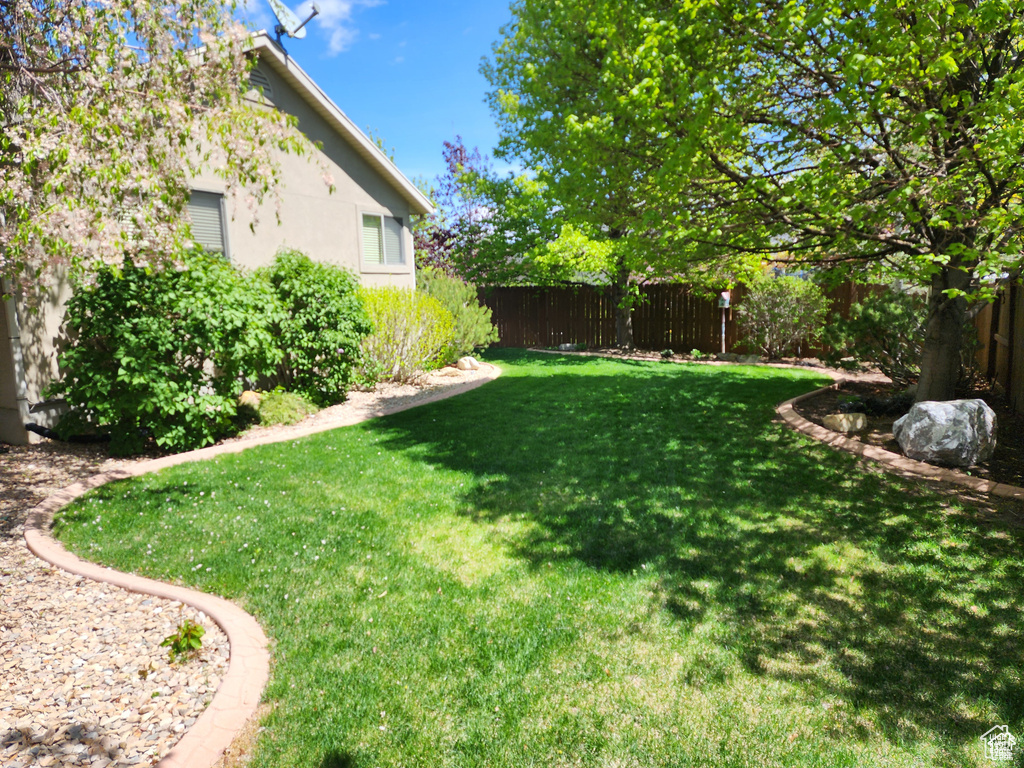 View of yard with a fenced backyard