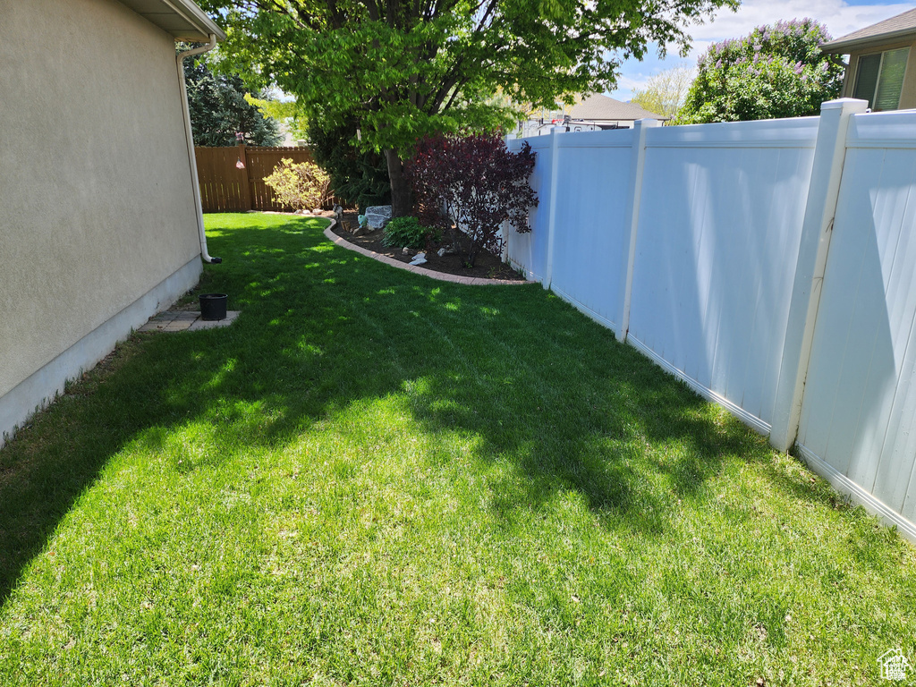 View of yard featuring a fenced backyard