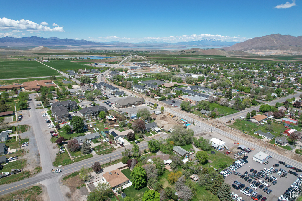 Aerial view of property's location featuring a water and mountain view