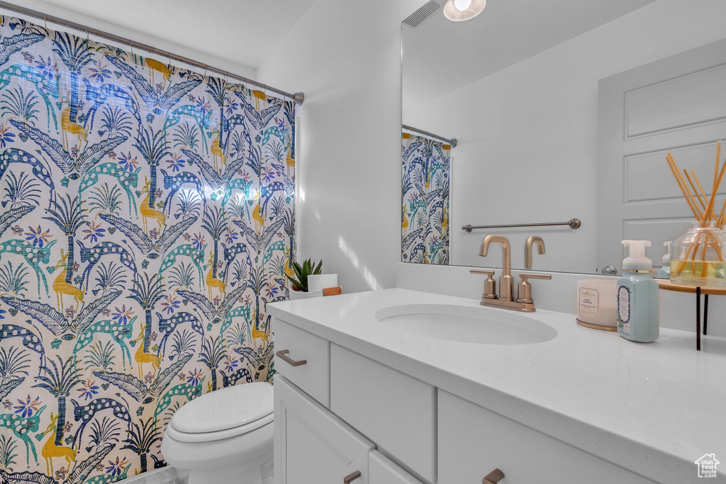 Bathroom with toilet and vanity
