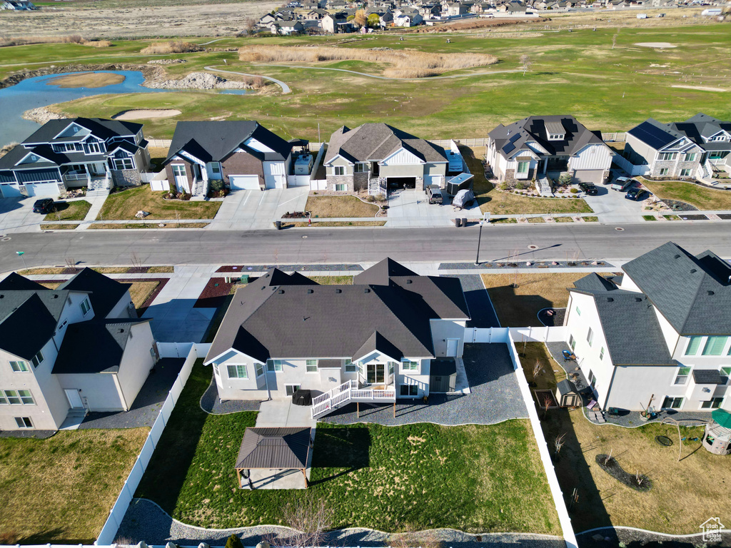 Birds eye view of property with a residential view, golf course view, and a water view