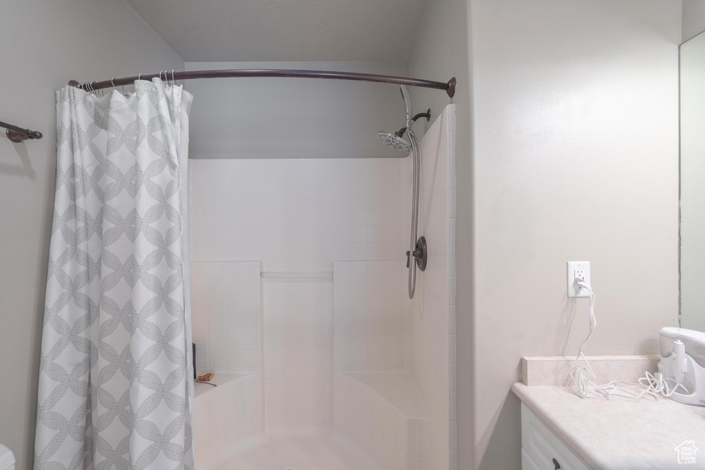 Bathroom with vanity and a shower with curtain