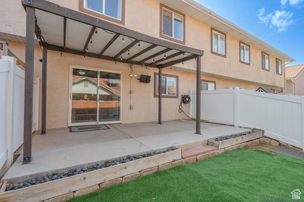 View of patio with fence
