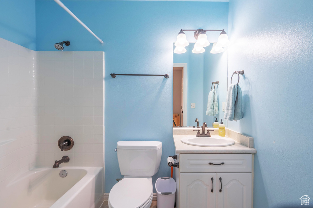 Full bathroom with toilet, shower / tub combination, and vanity