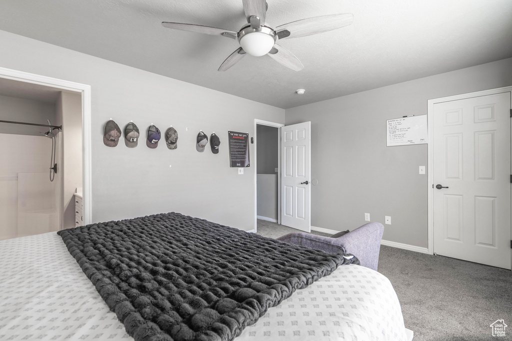Bedroom with carpet flooring, baseboards, and ceiling fan