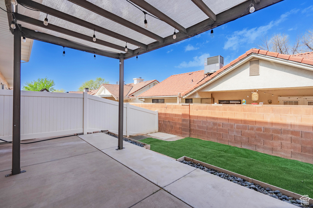 View of patio featuring a fenced backyard and a pergola