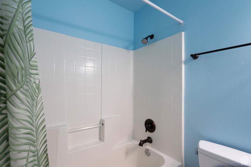 Full bathroom featuring toilet and shower / tub combo