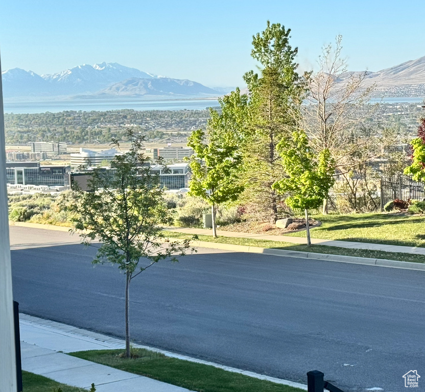 Exterior space featuring a mountain view and sidewalks