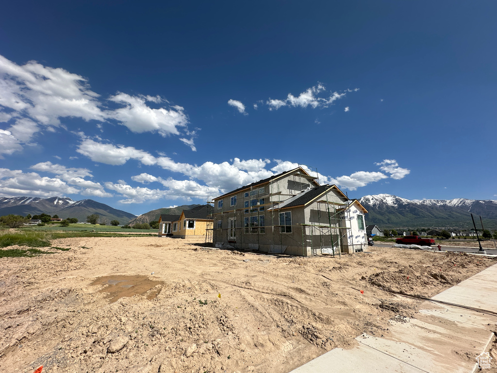 View of side of property featuring a mountain view