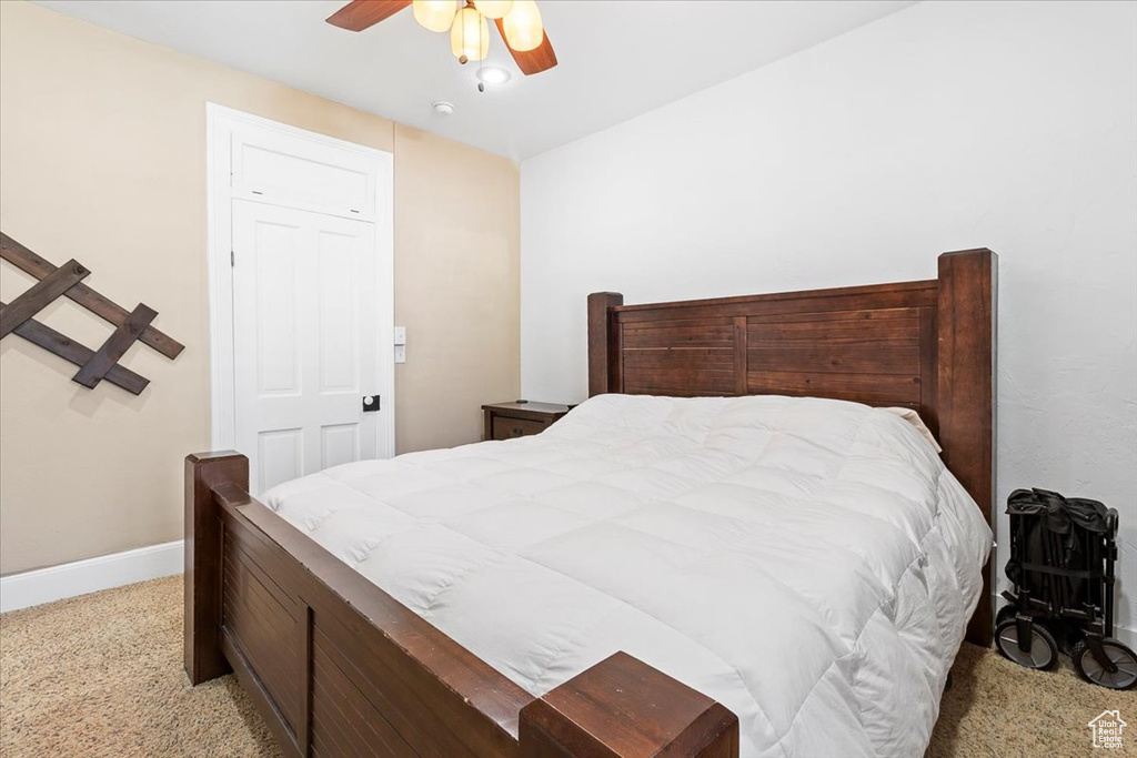 Bedroom with baseboards and ceiling fan