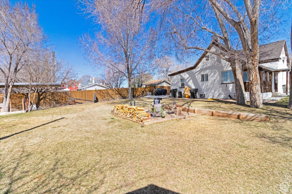 View of yard with a fenced backyard