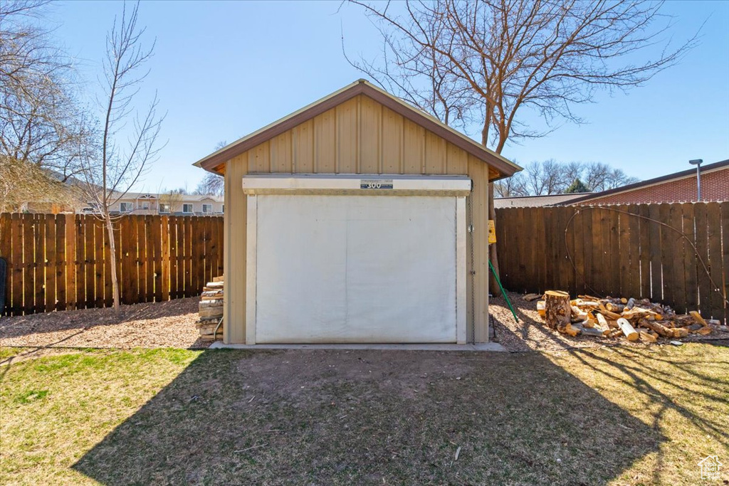 Garage with a storage unit and fence