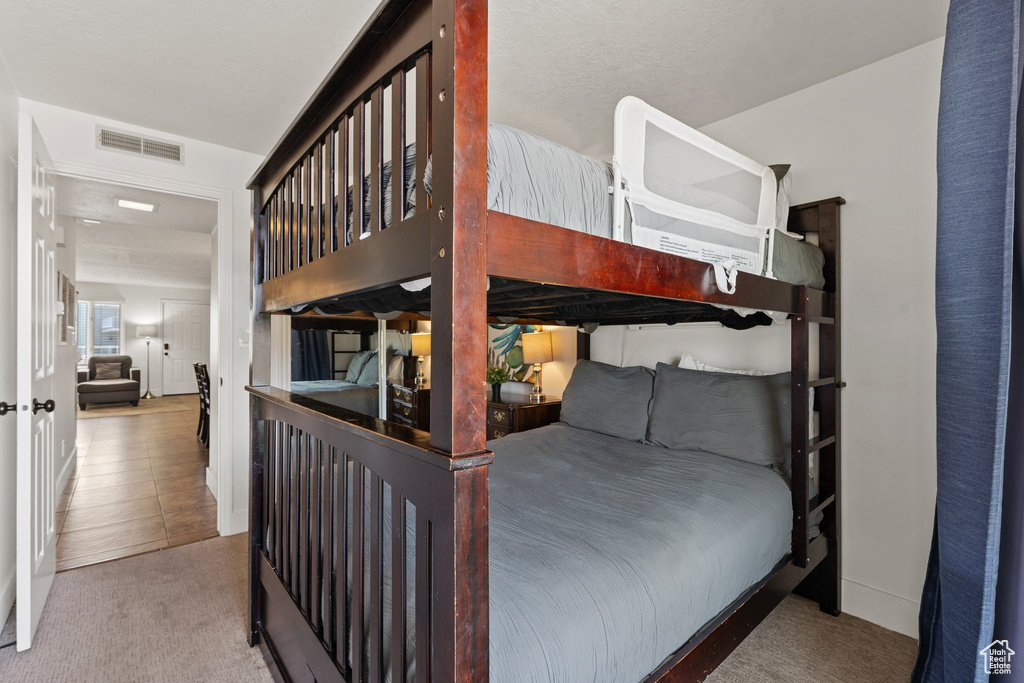 Bedroom featuring visible vents and carpet