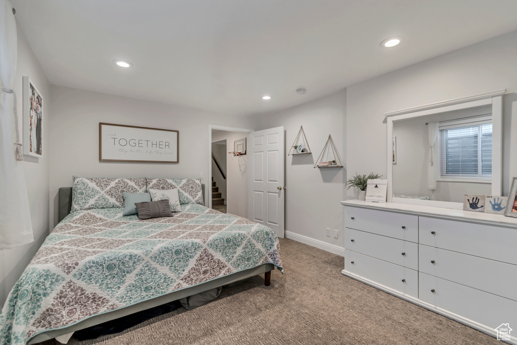 Bedroom with carpet, baseboards, and recessed lighting
