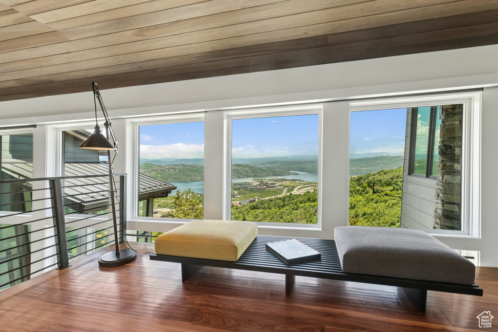 Sunroom / solarium featuring a water view