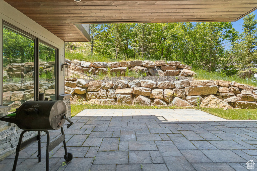 View of patio featuring area for grilling