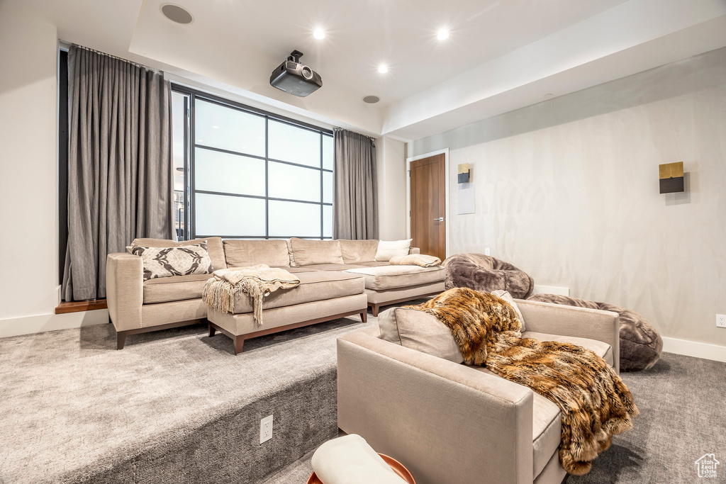 Living room with carpet flooring and recessed lighting