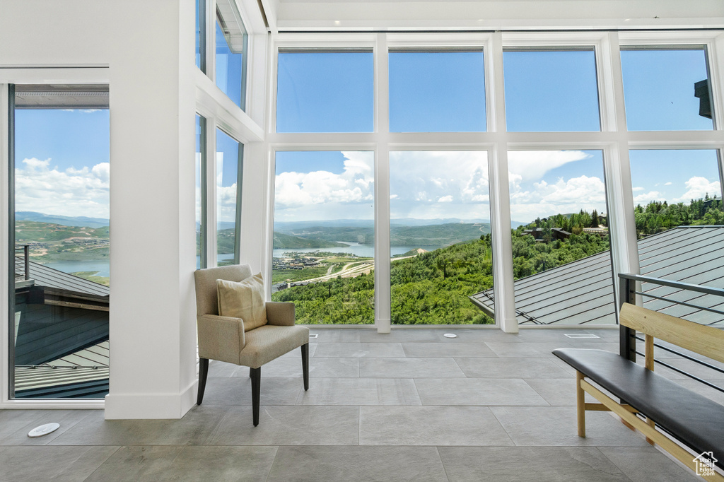 Sunroom with a water view