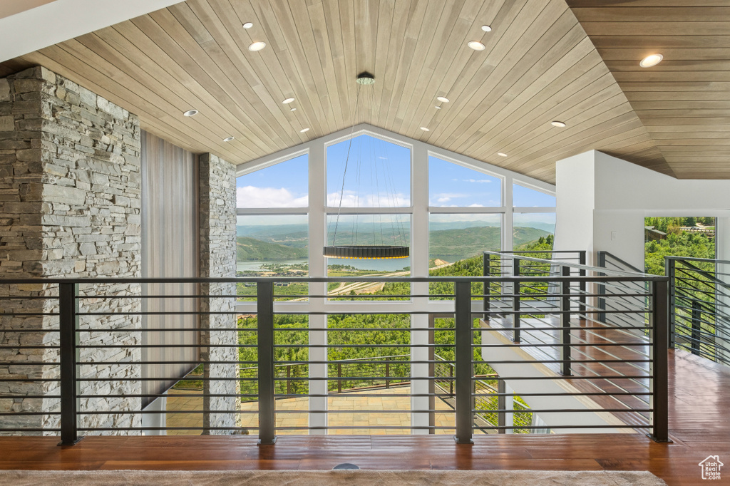 Balcony with a water and mountain view