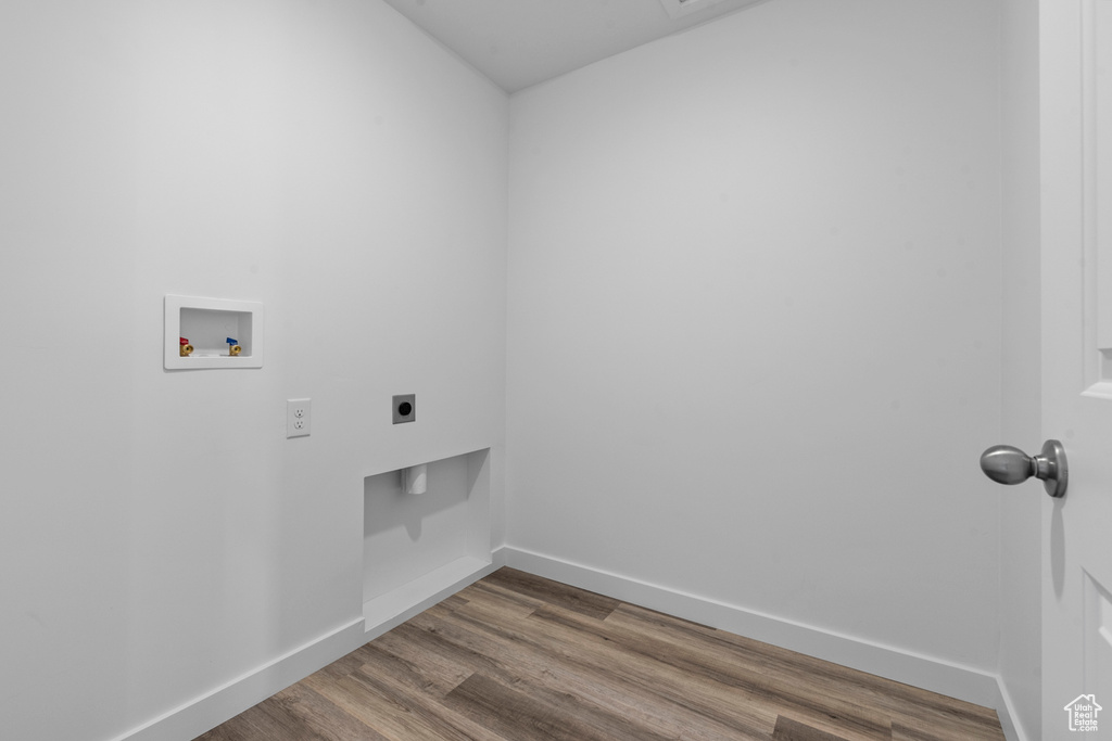 Laundry area with hookup for a washing machine, baseboards, laundry area, electric dryer hookup, and dark wood-style floors