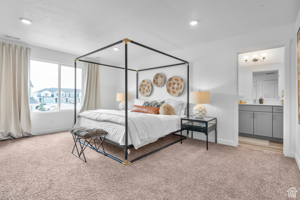 Bedroom featuring baseboards, recessed lighting, and light colored carpet