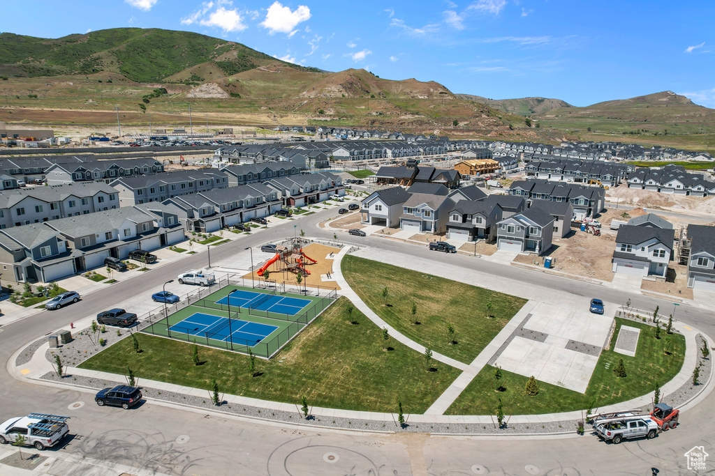 Birds eye view of property with a residential view and a mountain view
