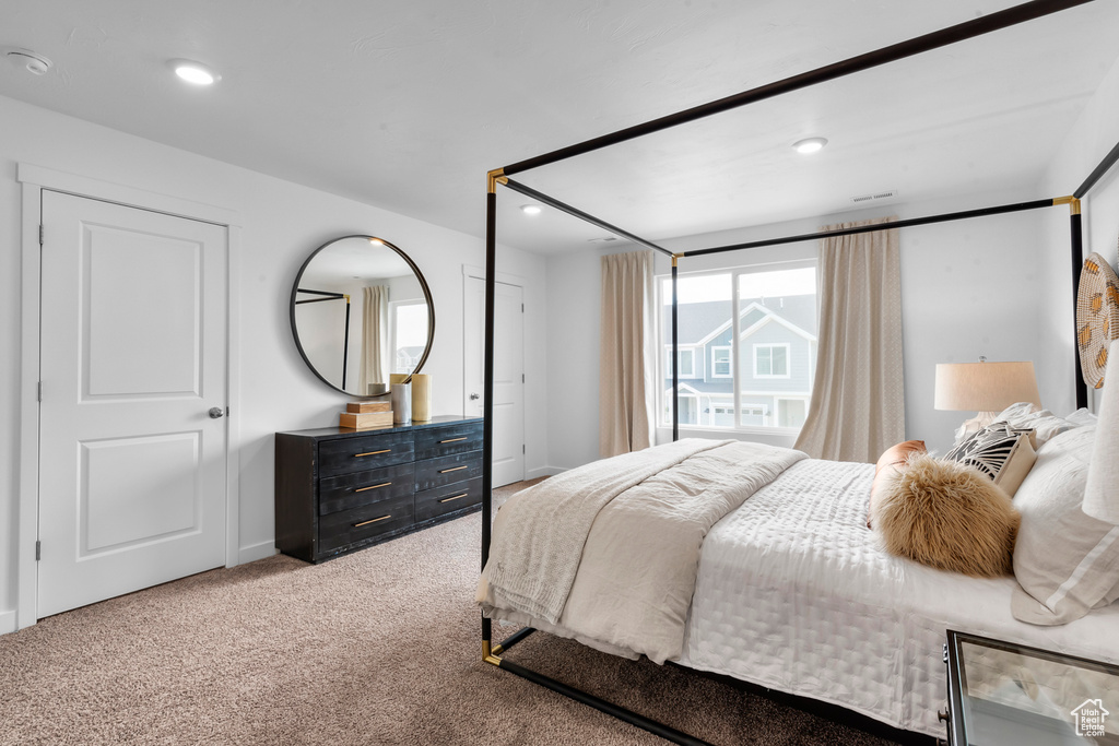 Carpeted bedroom featuring recessed lighting