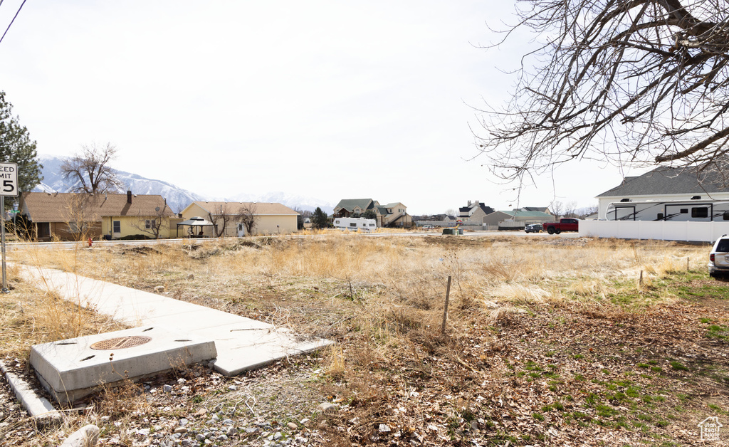 View of yard featuring a residential view and a mountain view