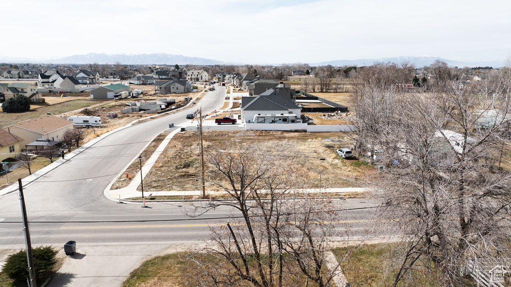 Aerial perspective of suburban area featuring a mountain backdrop