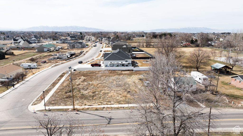 Aerial view of residential area featuring a mountain backdrop