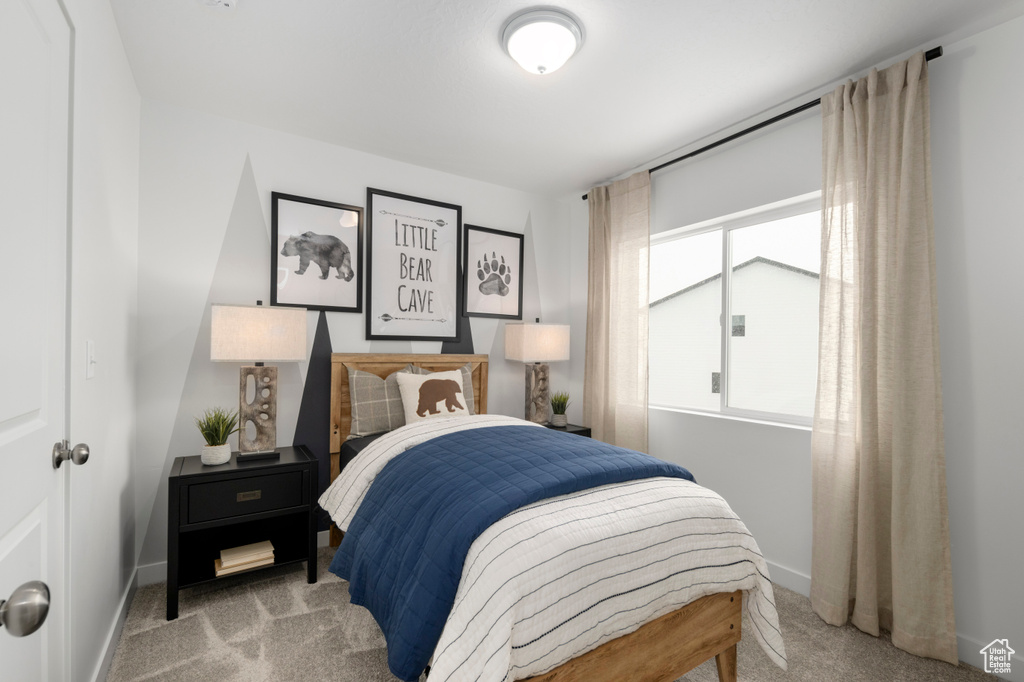 Bedroom with baseboards and carpet floors