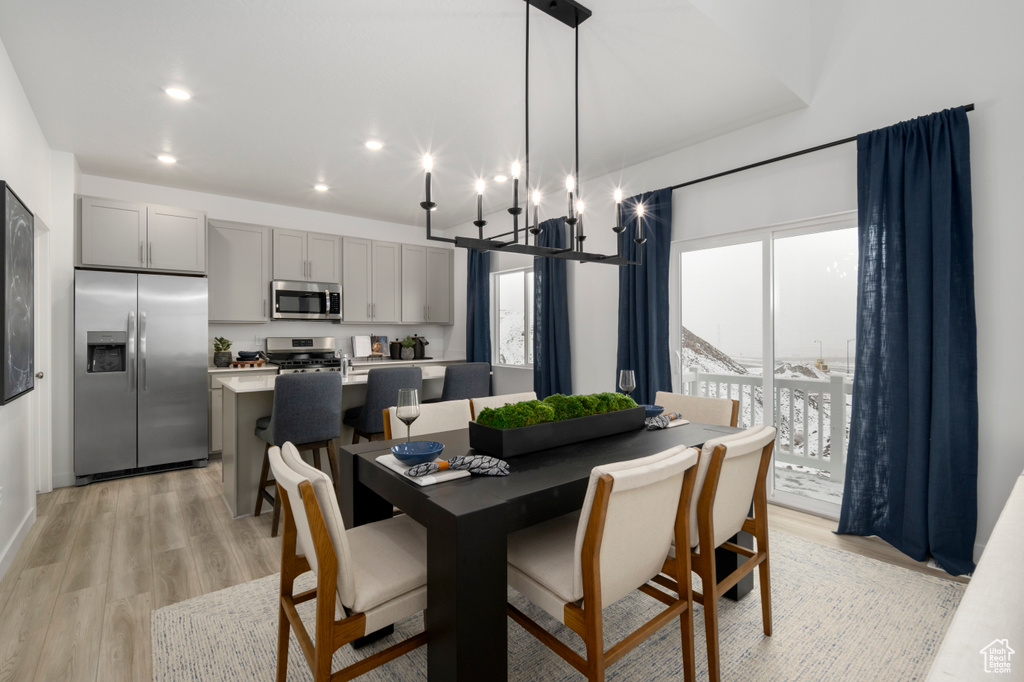 Dining space featuring light wood finished floors and recessed lighting
