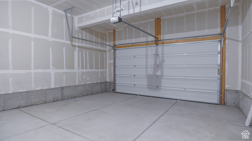 Garage featuring a garage door opener