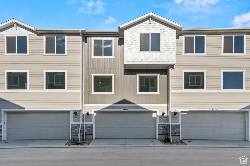 View of front of property featuring an attached garage