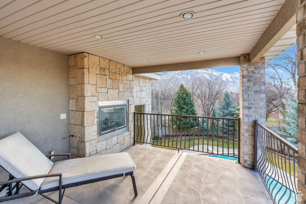 View of patio / terrace with a balcony and a mountain view