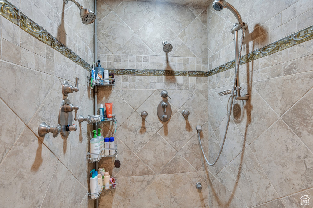 Full bath with a tile shower