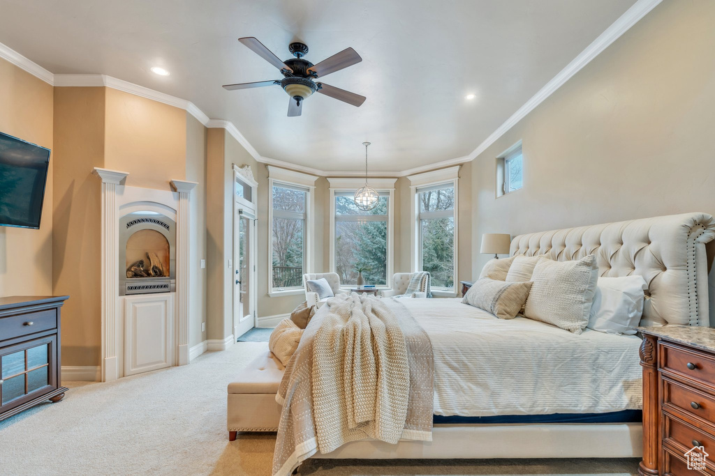 Bedroom with baseboards, ornamental molding, recessed lighting, and light colored carpet