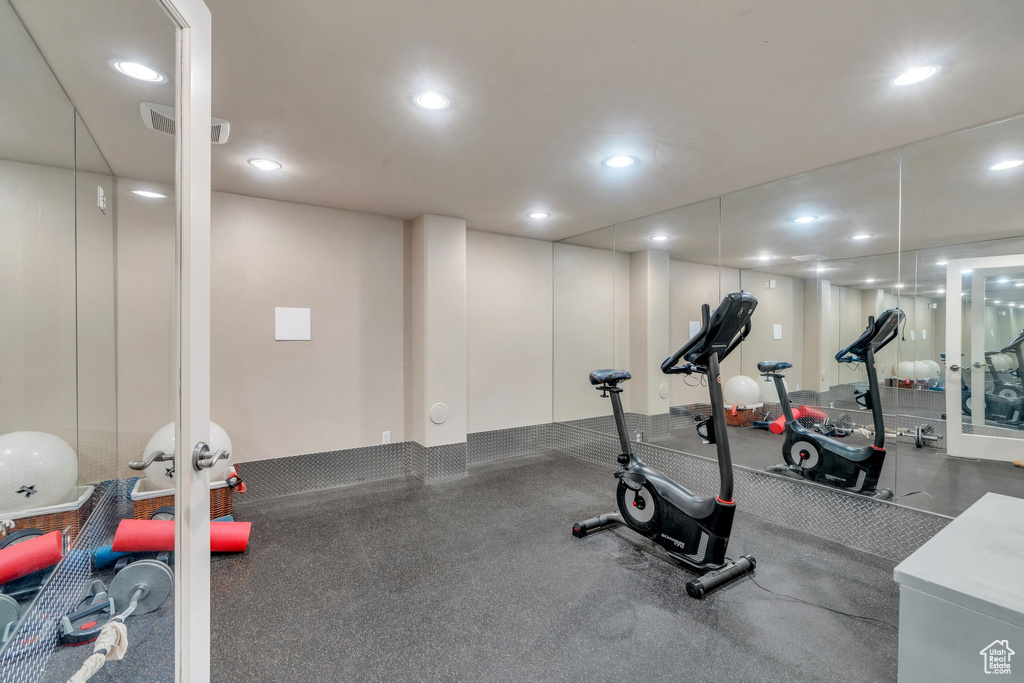 Exercise area featuring visible vents, french doors, and recessed lighting