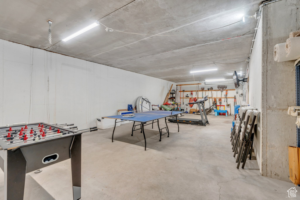Recreation room with concrete flooring