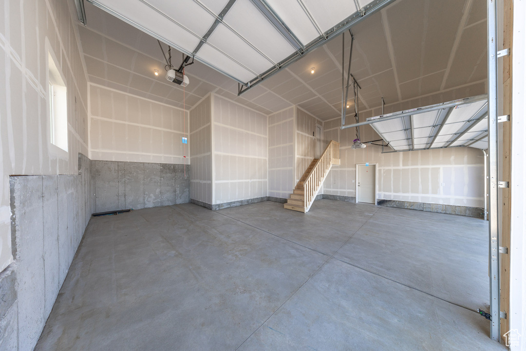 Garage featuring a garage door opener