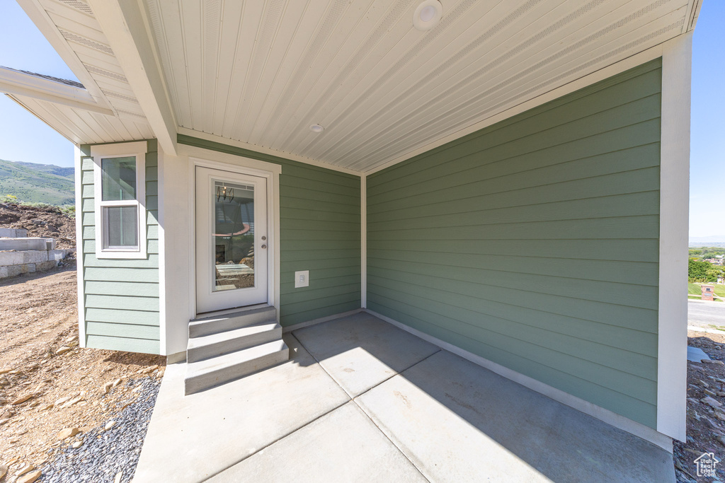 Property entrance featuring a patio