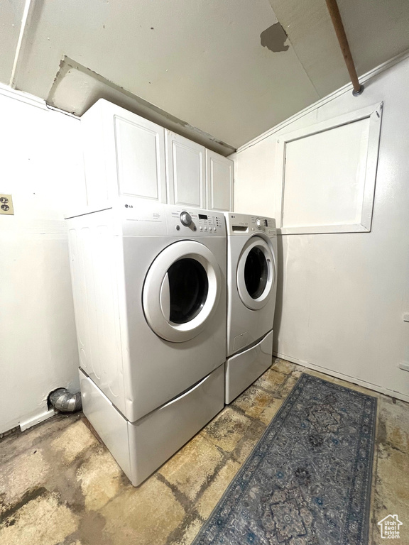 Clothes washing area with cabinet space and washing machine and dryer