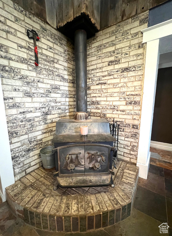 Details with baseboards and a wood stove