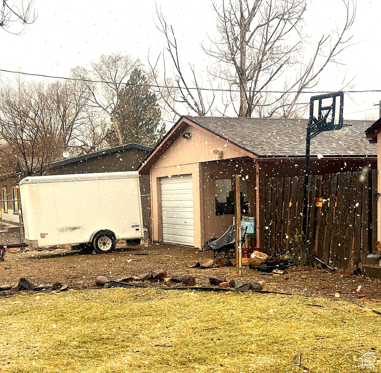 View of outbuilding featuring an outbuilding and dirt driveway